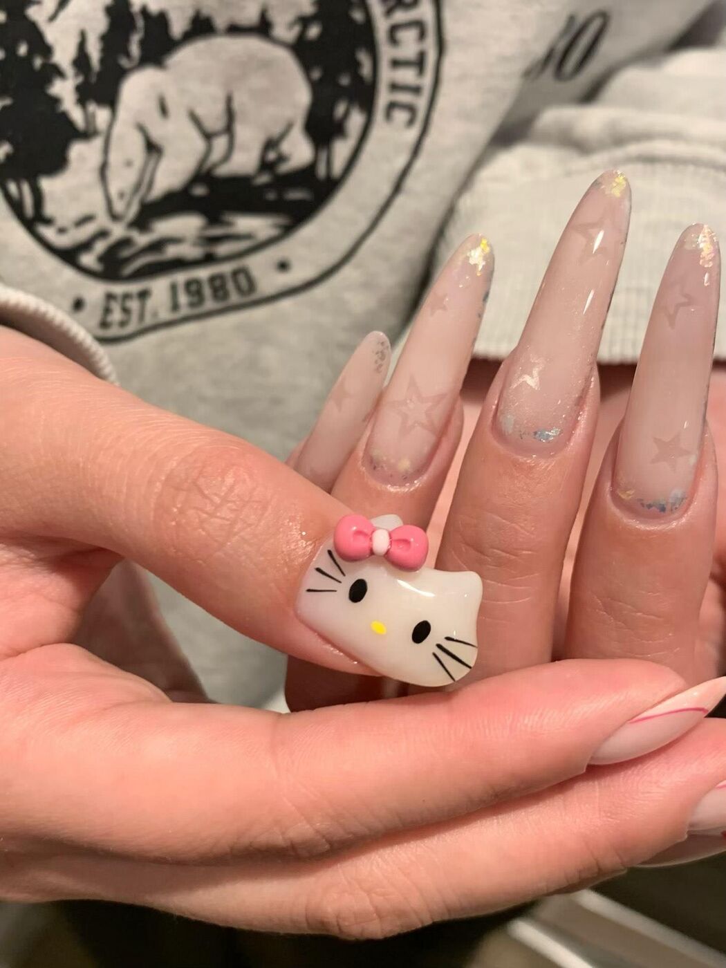 Hello Kitty charm on long nude Gel-X at KK Nail Studio, Long Island City nail salon