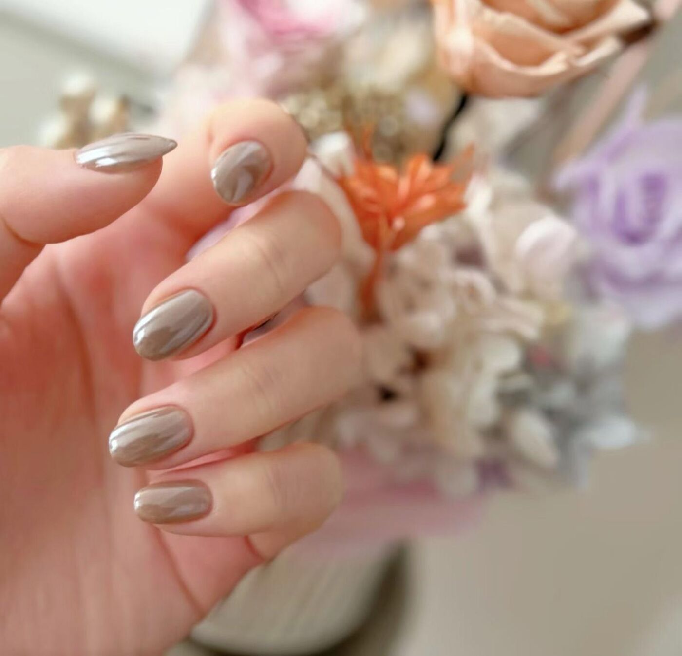 Silver chrome almond manicure at KK Nail Studio, Long Island City nail salon