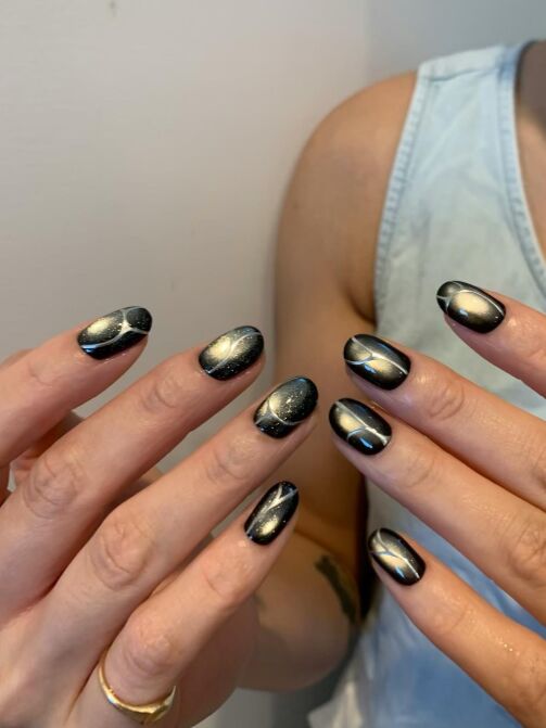 Black and gold textured metal art at KK Nail Studio, Long Island City nail salon
